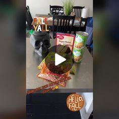 a table topped with lots of food and snacks on top of it's counter