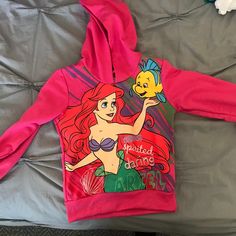 Size 4t Nwt Authentic Disney Ariel Toddler Hooded Sweatshirt. Pink. Themed Long Sleeve Tops With Cartoon Print, Themed Long Sleeve Top With Cartoon Print, Pink Long Sleeve Disney Top, Disney Princess Hoodie, Ariel Tshirt, Disney Cotton Hooded Sweatshirt, Mermaid Sweatshirt, Pink Long Sleeve Disney T-shirt, Toddler Disney Jacket