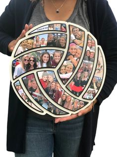 a woman holding up a photo collage with many different people in the frame on it