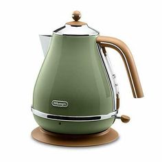 an electric tea kettle with wooden handle