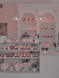 a bakery filled with lots of cakes and cupcakes