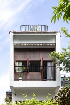 an apartment building with balcony and balconies