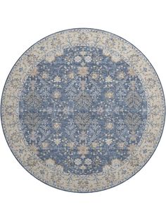 a blue and beige rug with an intricate design on the center, in front of a white background