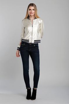 Show off an athletic yet sophisticated look with our Faux Leather Bomber Jacket. Featuring a varsity-inspired metallic pleather design with gold and navy striped trim, this jacket exudes a sporty, retro charm. The zip-up front and zipper pockets add practicality, while the light gold color and rib-knit trim enhance its style. The striped Mandarin collar adds a unique touch to this versatile jacket, perfect for a fashion-forward look. Metallic light gold pleather Rib-knit trim Striped mandarin co Light Gold Color, Versatile Jacket, Iconic Dresses, All Black Outfit, Cool Suits, Jacket Sale, Sporty Style, Blazer Coat, Mandarin Collar