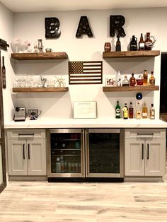 a kitchen with two ovens and some shelves on the wall above them that says bar