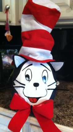 the cat in the hat is hanging on the wall