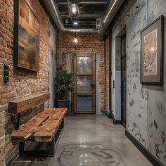 an empty hallway with brick walls and wooden benches