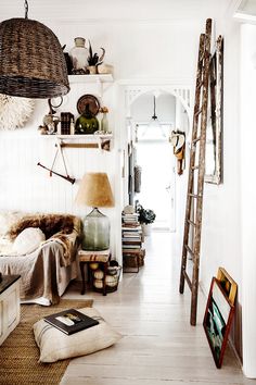 a living room filled with lots of furniture and decor