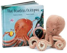 an octopus stuffed animal next to a book with the title'the fearless octopus '