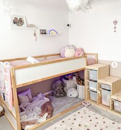 a child's bedroom with bunk beds and toys