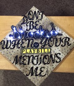 a graduation cap with lights on it that says, don't be ugly when you play in motions me