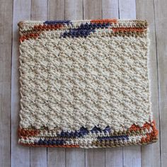 a crocheted dishcloth on a wooden surface