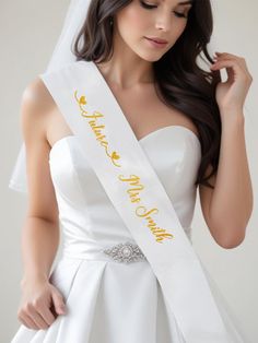 Celebrate your special day with our personalized bride veil sash, the perfect addition for any bachelorette party! This stunning set features a customized veil and sash, ensuring the bride to be stands out as she prepares for her big day. Our personalized veil and sash not only make for fabulous hen party gifts but also create unforgettable memories during the hen do festivities. Designed with the future Mrs. in mind, this beautiful bachelorette veil and sash are an essential for every bride to be. Make your celebration truly unique with our personalized veil and sash that are sure to impress! Bachelorette Veil, Bachelorette Accessories, Bachelorette Party Sash, Party Veil, Bachelorette Sash, Hen Party Accessories, Hen Party Gifts, Bride To Be Sash, Bride Veil