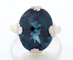 This raving beauty of an antique ring is just a showstopper and will look marvelous on your hand!  Significantly sized, this lustrous deep blue, oval shaped, multi-faceted topaz gemstone is held in place by thick white gold floral prongs which make a statement themselves. Every angle of this ring is intricately detailed, including an etched white gold bezel and delicate yellow gold wirework within the basket of the ring. You don't have to be a December baby for this one! Antique Ring - Antique 1 Antique Wedding Bands, December Baby, Antique Wedding, Antique Ring, Ring Antique, Filigree Ring, Blue Band, May 2023, Gold Floral