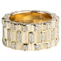 an 18k yellow gold and diamond band ring, by cartier's couture