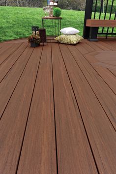 a bench sitting on top of a wooden deck