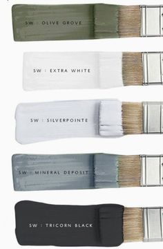 four different colors of paint brushes with names on the handles and sides, all labeled in white