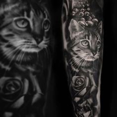 black and white tattoos on the arm of a man with a cat, flowers and roses