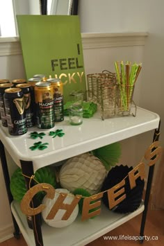 a table with drinks and decorations on it for st patrick's day party decor