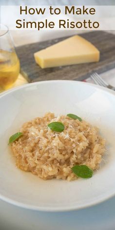 a white plate topped with risotto and cheese