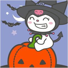 a cat in a witches hat sitting on top of a pumpkin