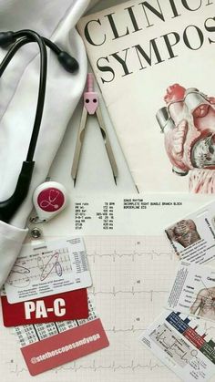 the contents of a medical kit including scissors, paper and other items are laid out on a table