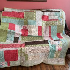 a couch with a quilt on top of it