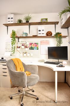 a chair sitting in front of a desk with a computer on it