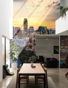 a dining room with a table and chairs in front of a city skyline wall mural