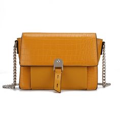 Meet our Hope Shoulder Bag, the chic shoulder bag that will be a style staple for seasons to come. Crafted from crocodile-embossed vegan leather matching high-quality smooth vegan leather, you will love this style to create a polished look. Open the magnetic snap to reveal a fully lined interior with a slip pocket and a wall zippered pocket, generously sized to hold all your daily essentials. The exterior features a slip front pocket. Its silver chain strap adds a touch of shine. Make our Hope S Evening Shoulder Bag With Crocodile Pattern, Daily Crocodile Pattern Clutch Shoulder Bag, Chic Yellow Textured Leather Bag, Chic Travel Shoulder Bag With Crocodile Pattern, Elegant Yellow Textured Leather Shoulder Bag, Chic Crocodile Pattern Satchel Shoulder Bag, Hobo Wallet, Hobo Crossbody Bag, Daily Essentials