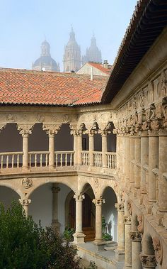 an old building with stone pillars and arches