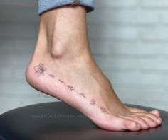 a person with a tattoo on their foot