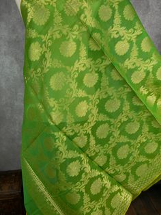 Stunning Banarasi Dupatta in Green Color with Muted Zari Weaving. Floral Design in Jaal with tassles. Give your Outfit a new look with these beauties. ❤️ Item: DupattaBase color : GreenFabric : Soft Semi Silk (Not Pure Silk)Work : Zari Weaved with tasselsLength of the Dupatta : 92 inches approx.Width of the dupatta : 35 inches (Approx.)Store Policies- No return or exchange will be accepted for color variations.- No return or exchange will be accepted if the color does not match your other clothi Elegant Green Brocade Dupatta, Green Saree With Woven Motifs For Traditional Ceremonies, Woven Motifs Dupatta For Wedding, Green Chanderi Traditional Wear With Woven Motifs, Green Dupatta With Woven Motifs For Traditional Ceremonies, Green Dupatta With Woven Motifs For Diwali, Diwali Green Dupatta With Woven Motifs, Pista Green Self-design Dupatta For Traditional Ceremonies, Pista Green Self Design Dupatta For Traditional Ceremonies