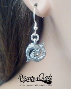 "I love these adorable Silver Pisces Earrings! The 3D charm has so much detail with two fish with sucker style mouths, eyes, scales, back fins and tail fins. It measures 1/2 inches long and 5/8 inches wide from tail fin to tail fin. It's made in the USA using lead free pewter. The French earwire is sterling silver with a coil and bead accent. Plastic earring backs are included. These lovely are ready to ship and will arrive in a gift box. View other BrattonCraft Astrology Jewelry here: https://w Symbolic Dangle Plug Earrings For Pierced Ears, Metal Symbolic Hypoallergenic Earrings, Pisces Earrings, Pisces Jewelry, Zodiac Earrings, Astrology Jewelry, Fish Earrings, Williamsburg Va, Two Fish