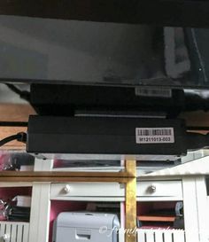 an electronic device is sitting on top of a shelf