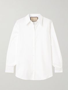 When it comes to Gucci's tailoring, it's always worth paying close attention to the finer details. This shirt is immaculately cut from crisp cotton Oxford with a sleek curved hem, so it tucks seamlessly into pants and skirts. Note the neatly pleated cuffs and glossy buttons. Gucci Formal Button-up Blouse, Elegant Gucci Button-up Blouse, Gucci Button-up Blouse For Formal Occasions, Gucci Designer Tops For Formal Occasions, Designer Gucci Tops For Formal Occasions, Gucci Formal Button-up Shirt, Chic White Gucci Top, Gucci Fitted Formal Top, Gucci Luxury Formal Blouse