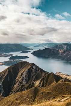 an aerial view of the mountains and water