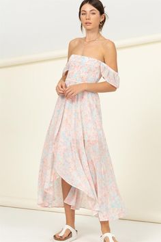 SHOW OFF YOUR TRUE COLORS IN THIS MIDI DRESS THAT CONSTRUCTS A FLORAL PRINT WITH AN OFF-THE-SHOULDER NECKLINE, A FITTED, SMOCKED BODICE THAT CASCADES INTO A FLARED, OVERLAPPING ASYMMETRICAL MIDI HEM. RUFFLE DETAILING ON THE SLEEVES. 100% POLYESTER IMPORTED. DESIGNED IN THE USA MODEL IS 5' 7" TALL, 32" CHEST, 23" WAIST AND 34" HIPS AND WEARING A SIZE SMALL Cascading Dress, Sunset Walk, Asymmetrical Midi Dress, Dress Colors, Yellow Midi Dress, Smocked Dress, Pink Midi Dress, Pastel Floral, Pink Fabric