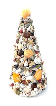 a christmas tree made out of shells and seashells