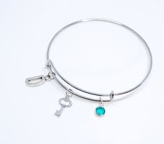 Small Key to my Heart  This bracelet listing includes: - Small Key charm 1.2*1 cm - a colored birthstone charm of your choice (0,238''/6 mm) - an initial charm of your choice - bracelets are made from 100% high-grade stainless steel, 65mm in diameter (for an adult) (If you want a diameter of 58 or 50 (for сhildren and adolescents), then write me a note) The real colors can differ from the colors on your screen. Additional Initial charms can be purchased for €2,77 each https://www.etsy.com/listin Hypoallergenic Emerald Bracelet Jewelry, Birthday Charm Bangle Bracelet, Nickel-free Metal Charm Bracelet For Birthday, Silver Birthstone Jewelry For Friendship, Silver Charm Bracelet For May Birthstone Gift, Adjustable Dangle Jewelry For Birthday Gift, Personalized Silver Charm Bracelet With Birthstone, Nickel-free Charm Bracelet As Birthday Gift, Nickel Free Charm Bracelet For Birthday Gift