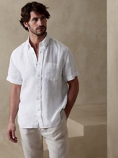 Luxurious, beautiful and naturally breathable, this linen shirt is crafted from 100% linen--a favorite for its ability to stay crisp and fresh even in heat and humidity.  UNTUCKED: Specially cut 1" shorter through the body for an untucked fit that st Linen Men Outfit, Neutral Family Photos, Mens Banana Republic, Boys Khaki Pants, White Party Outfit, Summer Family Photos, Short Sleeve Linen Shirt, White Linen Shirt, Beach Family Photos