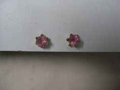 14K Pink Stone Stud Yellow Gold Earrings Vintage Karat KT Solid Pierced Post Materials: 14K solid gold metal marked (14K), (pink stones - do not know what they are made from) with plastic/silicone post backs Condition: excellent vintage Measures - 5mm x 5mm x 4mm Maker's mark - P Questions welcome. Pink Earrings For Anniversary, Pink Earrings With Prong Setting For Anniversary, Pink Prong Set Earrings For Anniversary, Pink Pierced Jewelry For Formal Occasions, Pink Birthstone Round Earrings, Pink Round Birthstone Earrings, Pink Wedding Earrings With Birthstone, Pink Round Earrings With Prong Setting, Pink Prong Set Round Earrings