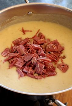 the food is being prepared and ready to be cooked in the pot on the stove