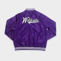 On the front of this purple bomber jacket, we incorporated the block “N” and wildcat logo Northwestern used from 1981-2011. For an added vintage touch, we think the retro Northwestern baseball script on the back of the jacket makes it crystal clear that you're wild about the 'Cats. Purple Varsity Jacket For Fall Streetwear, Casual Purple Varsity Jacket For College, Purple Varsity Jacket For Streetwear, Purple Varsity Outerwear For College, Wildcats Logo, Vintage Script, Wild Cats, The Block, Crystal Clear