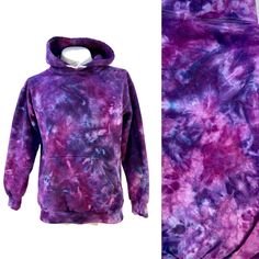 95% cotton/5% polyester preshrunk hoodie with kangaroo pocket in size Small.  Brand - King. They're made in Canada! This hoodie was ice dyed with imperial purple, grape, and red violet. If you are unsure of what size is right for you, measure one of your own flat, armpit to armpit. Double that for a chest measurement. The back length is measured from where the hood attaches at the back to the bottom. This measurement is less important for fit; it just gives you an idea of how long it is. GARMENT Imperial Purple, Ice Tie Dye, Red Violet, Tie Dye Cotton, Ice Dyeing, Cotton Hoodie, Kangaroo Pocket, Gender Neutral, Tie Dye