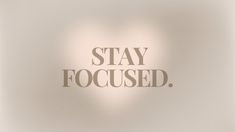 the words stay focused are displayed on a white background with soft light and shadow effects