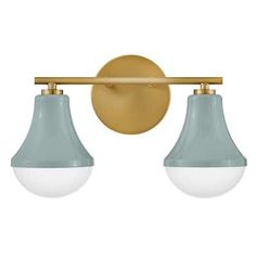 Lark's Haddie Two-Light Bath Vanity light fixture features a pair of sleek, tapered shades, rounded out by a curved Cased Opal Glass, and suspended at either end of a rounded Lacquered Brass rod. In a trio of complementary finishes - Black, Lacquered Brass, and Seafoam - this shapely Mid-Century Modern fixture can be mounted up for ambient light, down for focused light around vanities in bathrooms, powder rooms, or ensuites. Dimmable, and illuminated by two 10-Watt Medium LED bulbs (not included Vanity In Bathroom, Retro Vanity, Traditional Vanity, Vanity Light Fixtures, Light Vanity, Led Vanity, Bath Light, Bath Vanity Lighting, Guest Bath