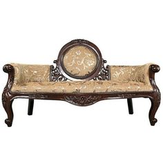 an ornate wooden bench with beige upholstered fabric