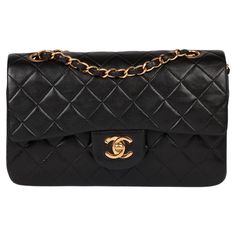 Chanel Black Quilted Lambskin Vintage Small Classic Double Flap Bag Product Details Xupes Ref: HB5639 Brand: Chanel Model: Small Classic Double Flap Bag Type: Shoulder Serial Number: 3744899 Age: 1996 RRP: £8,510 Accompanied By: Chanel Dust Bag, Authenticity Card Colour: Black Hardware: Gold (24k Plated) Material(s): Lambskin Leather Specification Height: 15cm Width: 23cm Depth: 7cm Strap Drop: Single: 38cm Double: 22cm Interior: Black Leather Closure: Turn Lock Country of Origin: France Authenticity Details: Serial Sticker, Authenticity Card Condition Condition Rating: Excellent Exterior Condition: The exterior is in excellent condition with minimal signs of use. Interior Condition: The interior is in excellent condition with minimal signs of use. Hardware Condition: The hardware is in ex Chanel Model, Black Quilt, Chanel Black, Black Hardware, Vintage Chanel, Clothing Ideas, Classic Flap, Flap Bag, Lambskin Leather