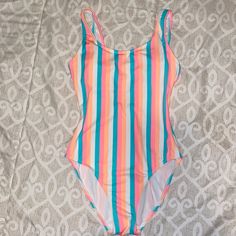 One Piece Swimsuit Condition: Like New / Never Worn Color: Bright / Pink, Blue, Orange, White Size: Small Cute For Sitting By The Pool Or Vacation!!! Smoke Free Home!!! Multicolor Stretch Bodysuit For Beach Party, Stretch Multicolor Bodysuit For Beach Party, Striped Stretch Bodysuit For Poolside, Striped Stretch Summer Bodysuit, Striped Stretch Bodysuit For Summer, Casual Multicolor Bodysuit For Swimming, Spring Striped Bodysuit For The Pool, Casual Multicolor Bodysuit For Beach Season, Striped Summer Bodysuit For Beach Season